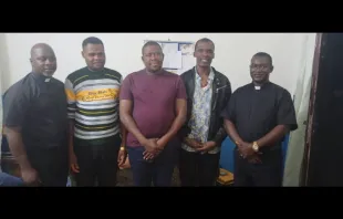 The three seminarians (C) who were released Oct. 13, 2021 by their captors, between Fr. Emmanuel Faweh Kazah, rector of the St Albert Institute, and Fr Jonah Yabanad Stephen, rector of Christ the King Major Seminary. Aid to the Church in Need International