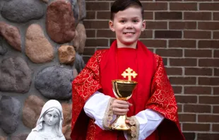 Teddy Howell, a Michigan third grader, dressed as a priest. Stephani and Sean Howell
