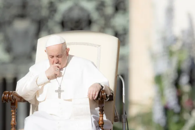 Pope Francis prays at his Wednesday audience in St. Peter’s Square on April 12, 2023.