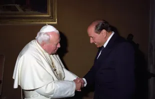 St. Pope John Paul II greets former Italian Prime Minister Silvio Berlusconi. Vatican Media