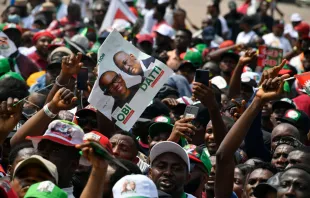 Supporters hold a placard with pictures of the candidate of the Labour Party Peter Obi and running mate Datti Baba-Ahmed during a campaign rally of the party in Lagos, Nigeria, on Feb. 11, 2023. Pius Utomi Ekpei/AFP via Getty Images)